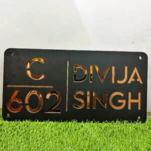 Customizable acrylic name plate with golden letters, adding a touch of elegance to any space.