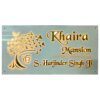 Customizable name plate with a white backdrop and golden letters, ideal for modern décor.